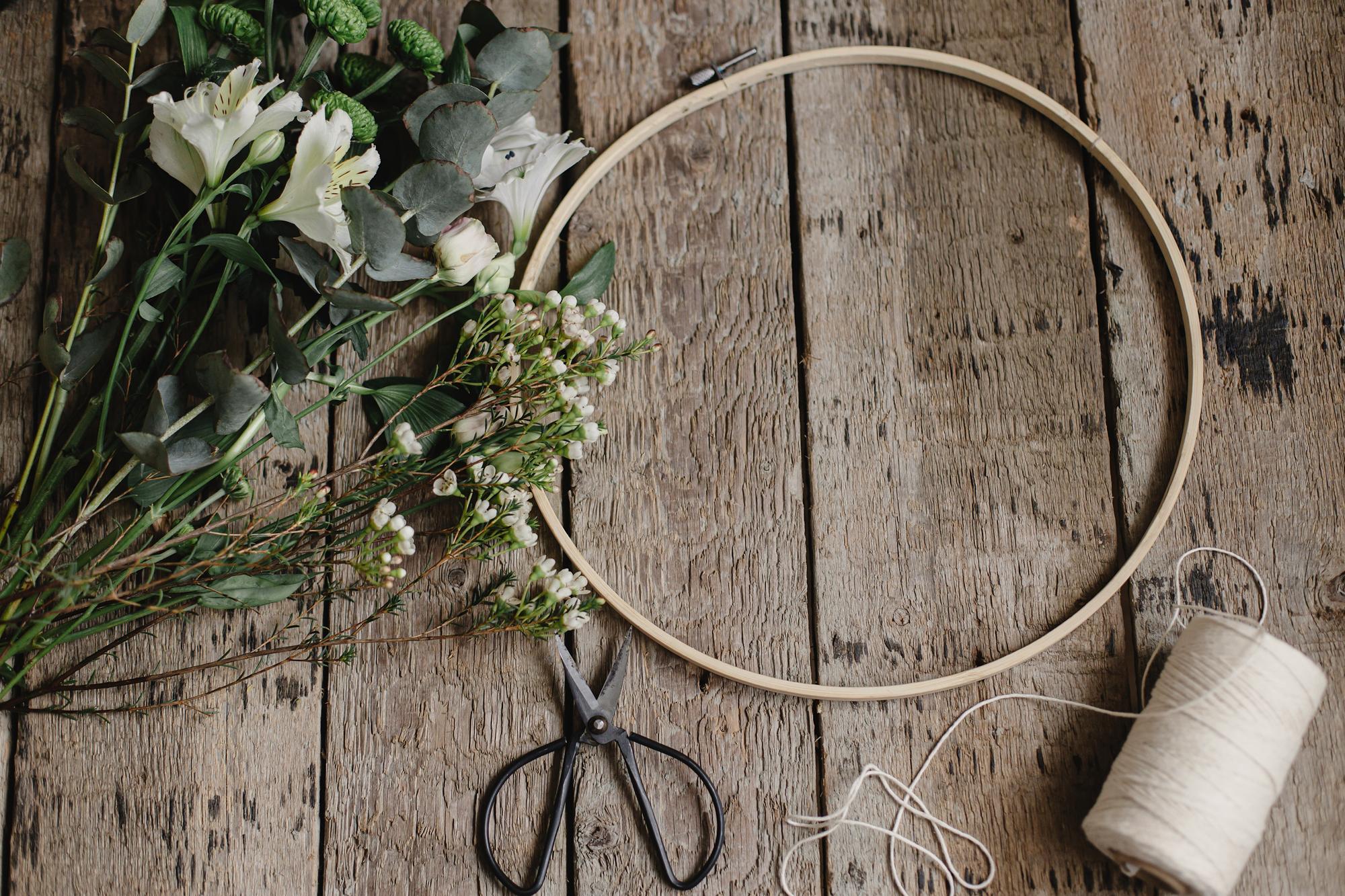 close-up of hand embroidery hoop with floral pattern