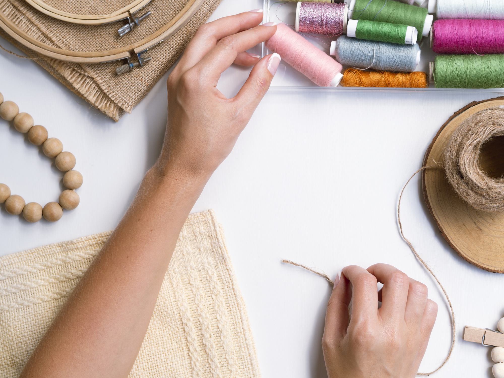 hands teaching embroidery stitch technique